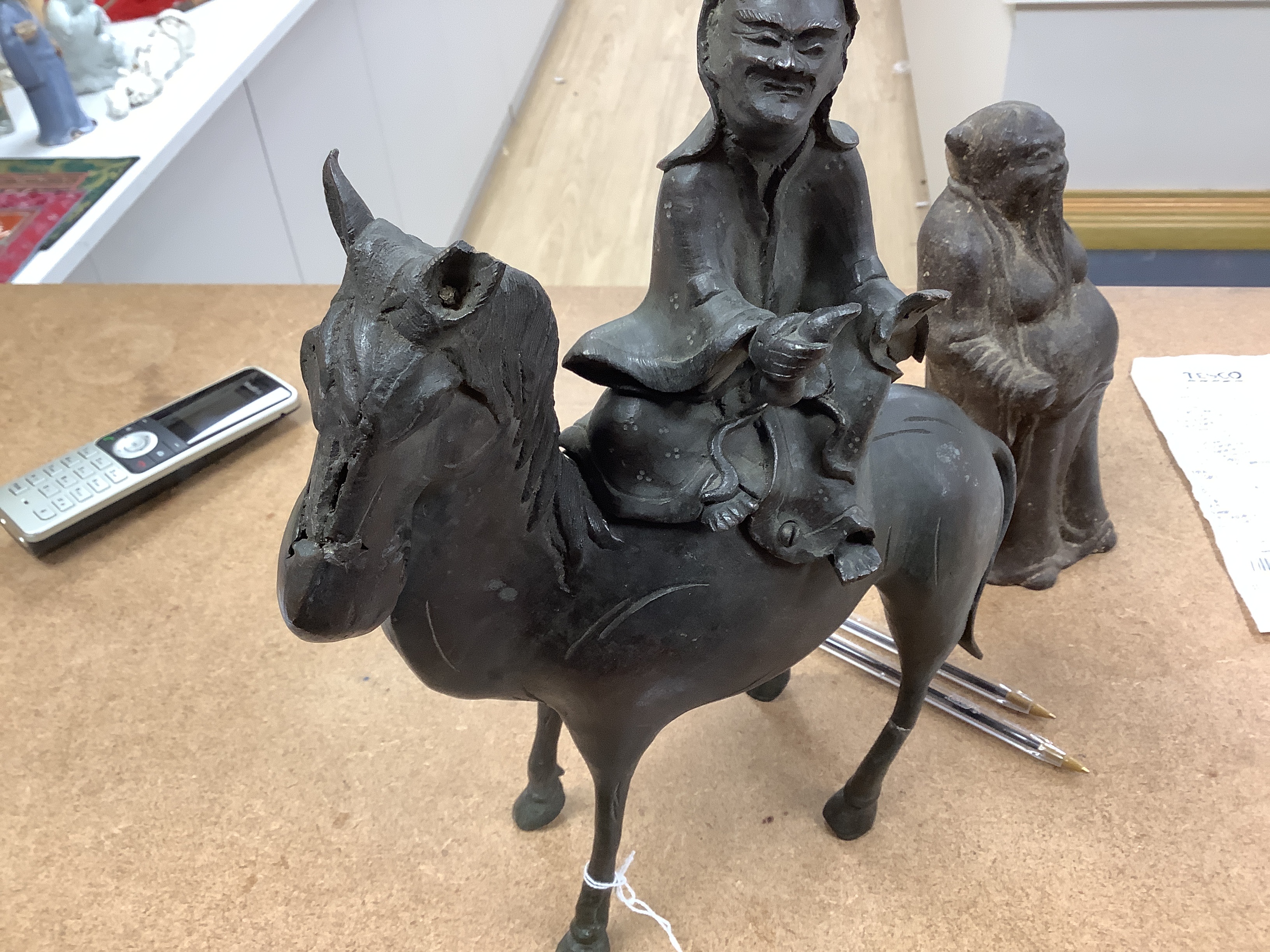 Two Chinese bronze figures, one of a luohan on his mule, the other a figure of a wise man, tallest 30cm